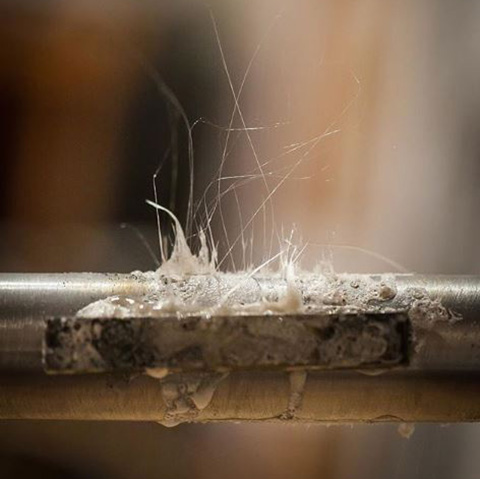 Strings of flux after a brazed dropout.